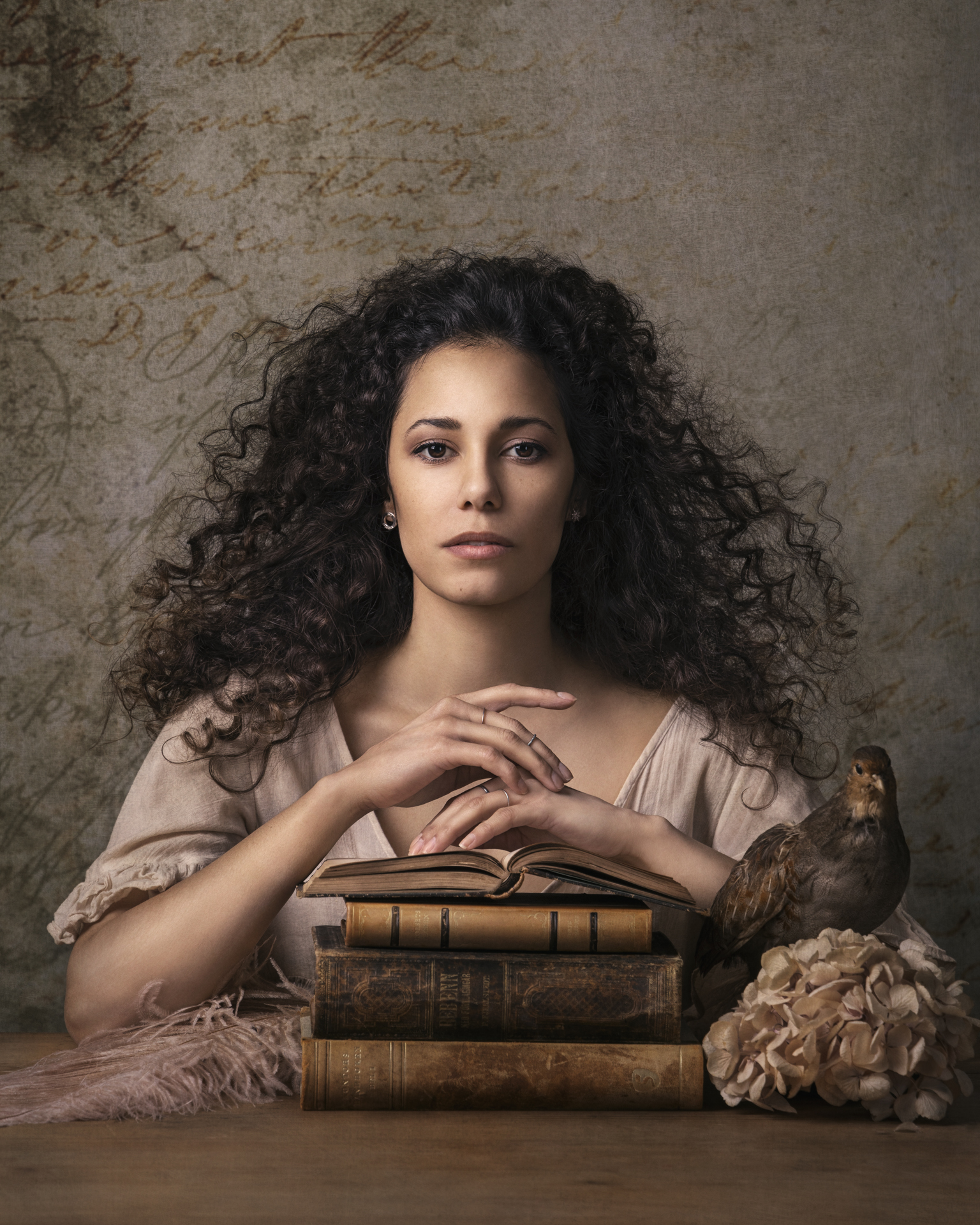 Finished painterly edit of a portrait with books and a bird