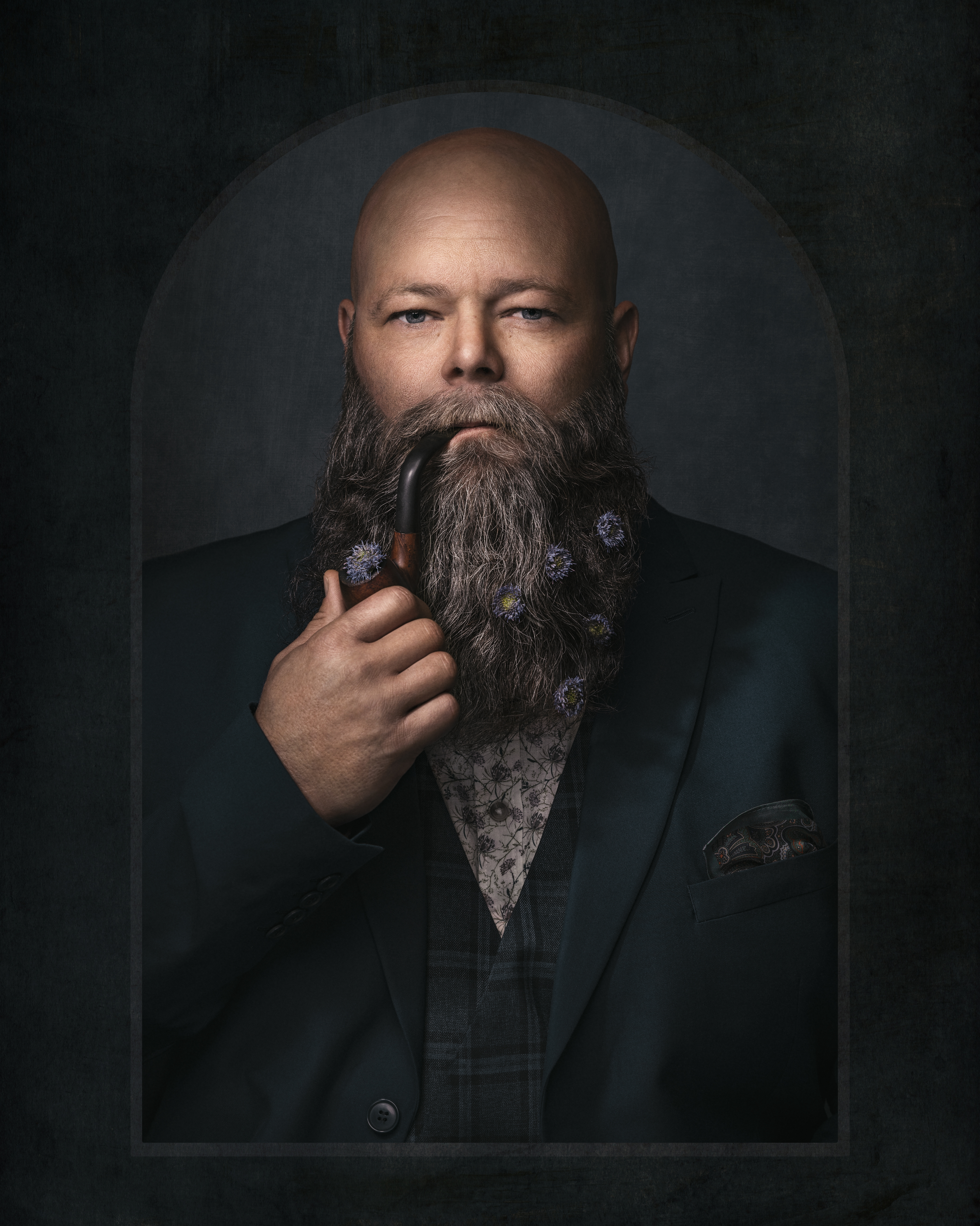 Fine Art portrait of a bearded man with a pipe