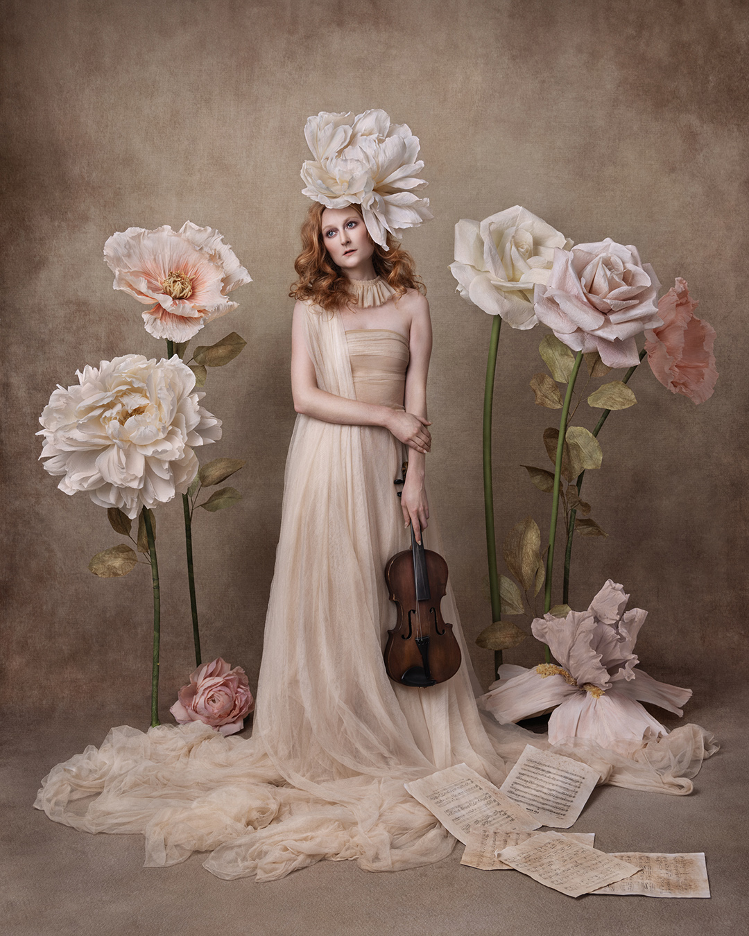 Fine Art portrait of a woman in a flower garden holding a violin